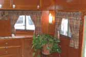 Detail photo of beautiful wood paneling and ceiling in 1938 Kozy Coach Trailer